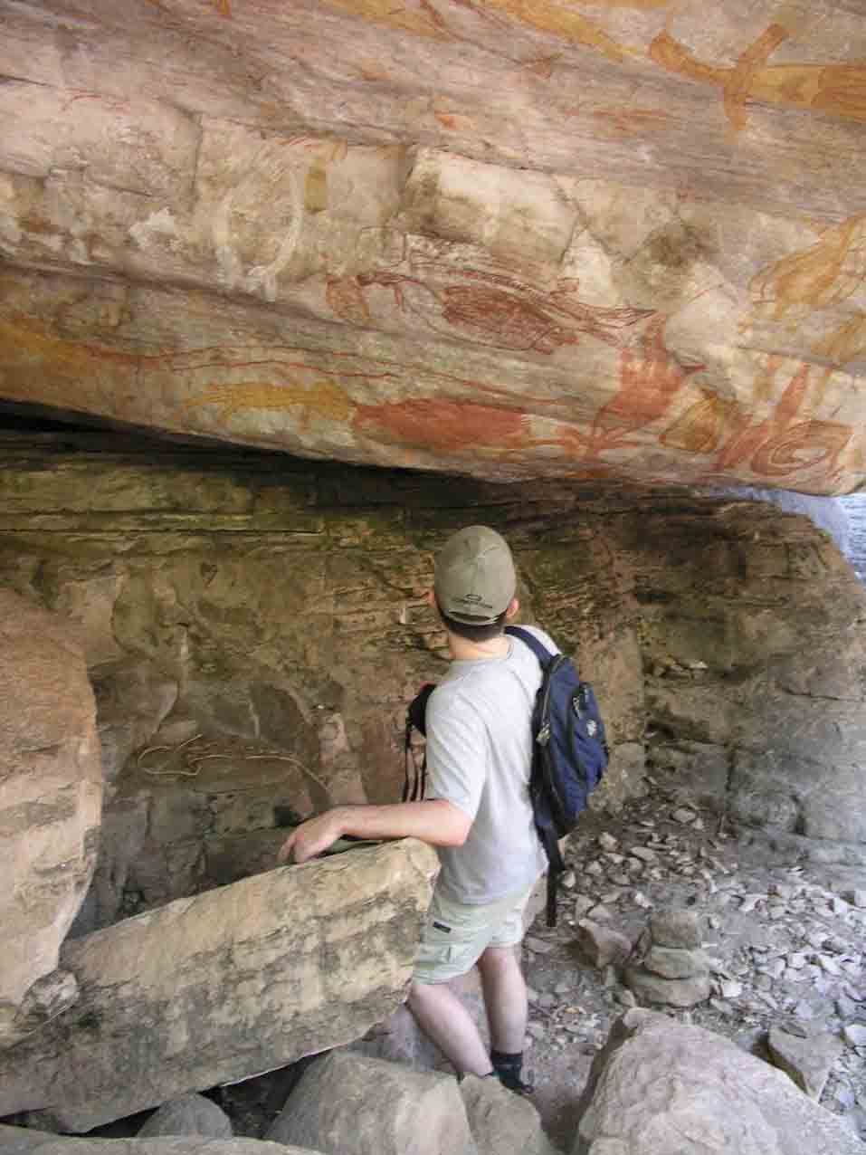 Nathan viewing rock paintings on Injalak Hill