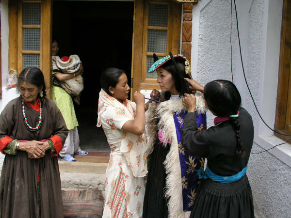 Sue being dressed up in traditional Ladakhi clothes at Namgial's house in Domkhar Do