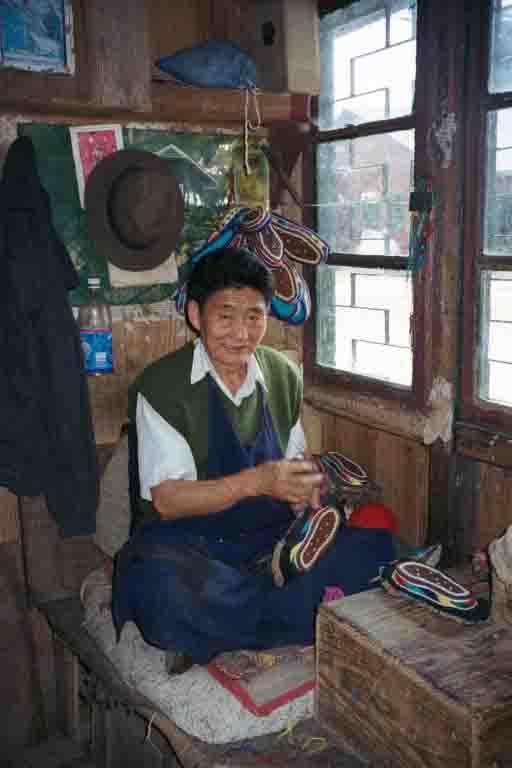 Traditional Tibetan shoemaker at Tibetan Self-help Centre, Darjeeling